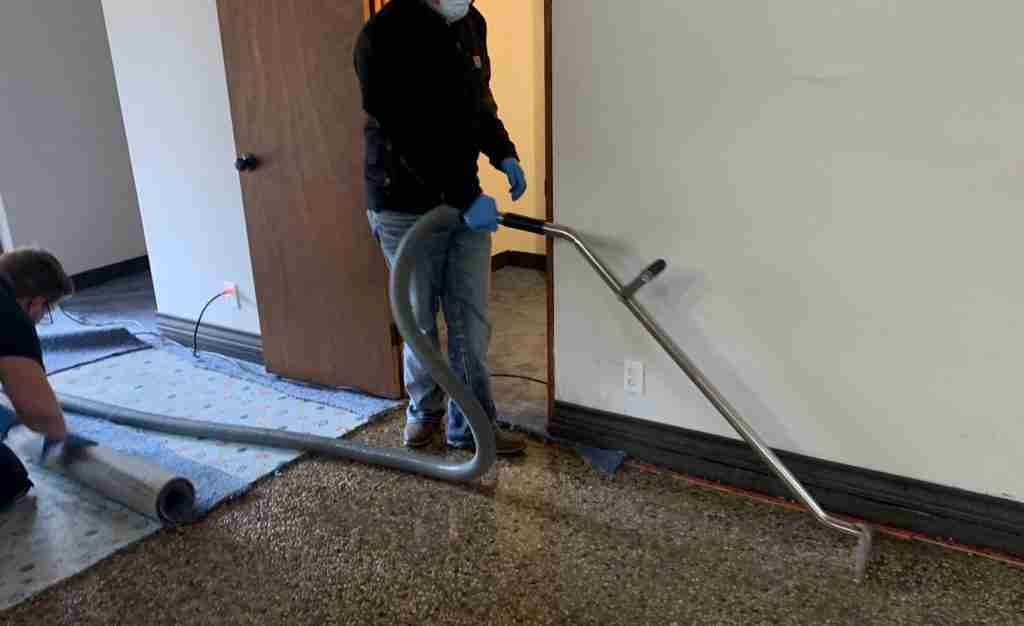 Ben Haugh extracting water from a flooded building