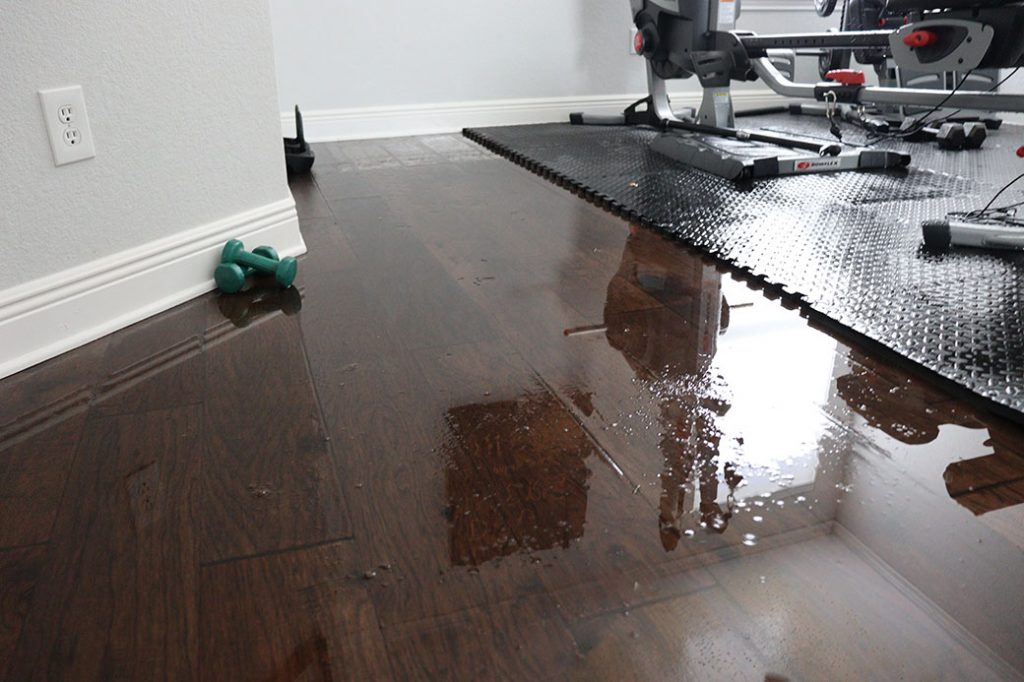 Water-on-Floor-in-Home-Gym