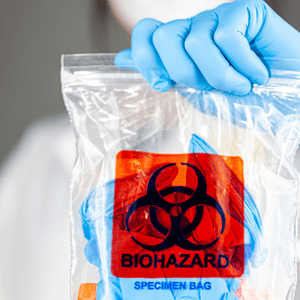 Person Holding a Bag of Biohazard Disposal