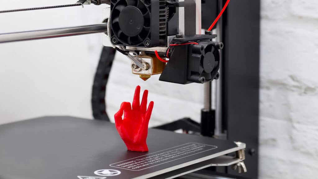 printer with 3D printed hand with OK sign