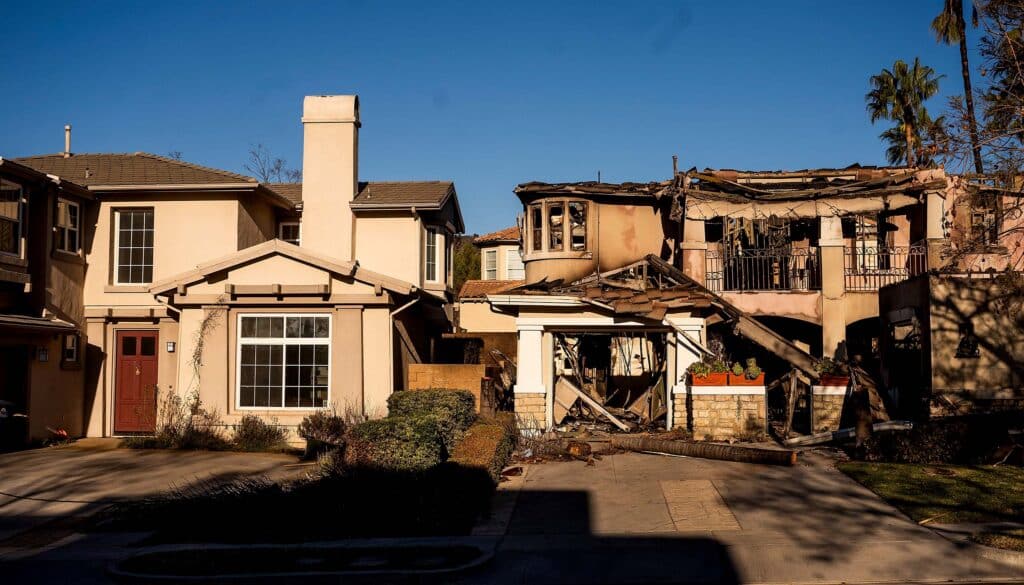 two homes post-wildfire one is destroyed one is intact