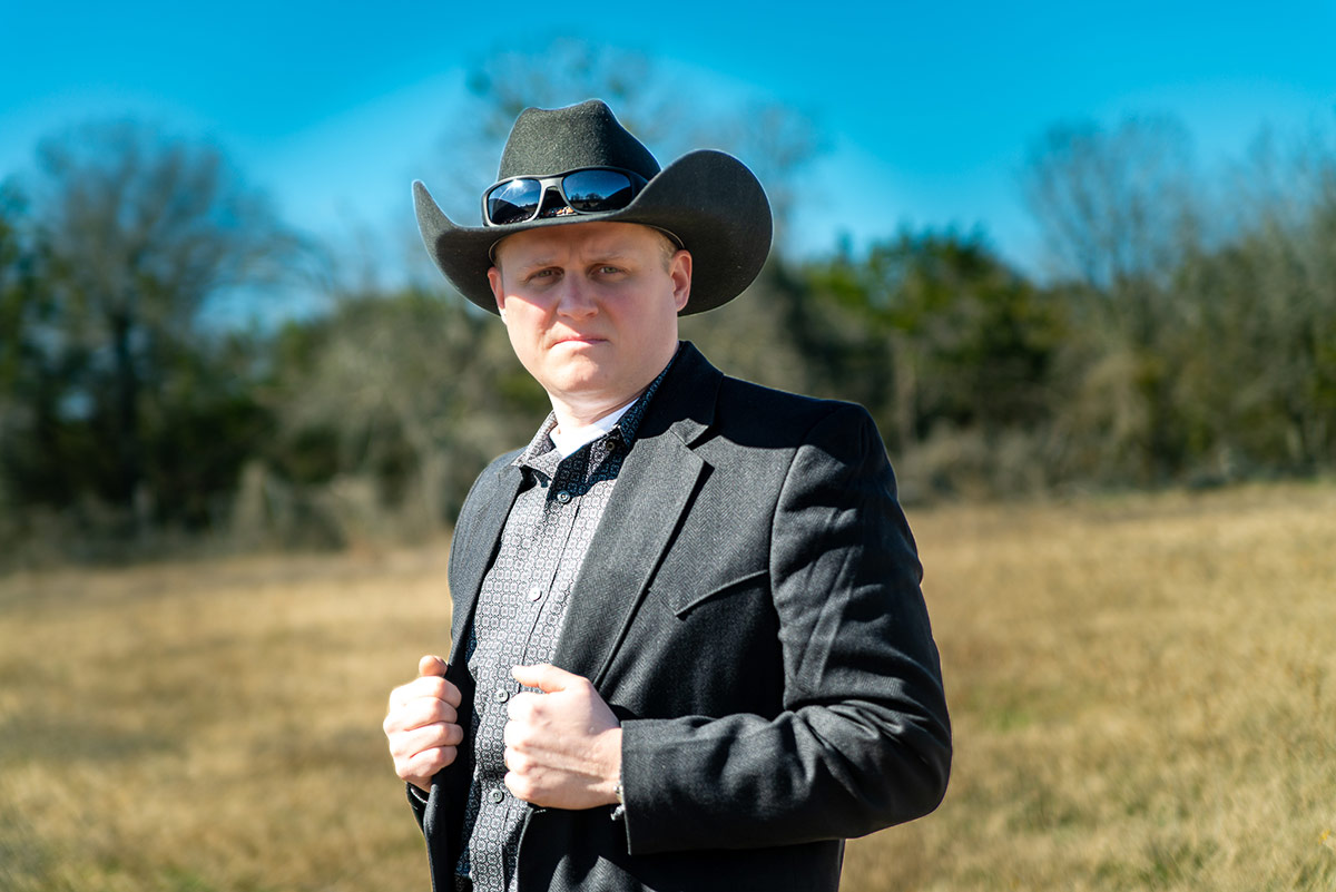 benjamin haugh in sports coat and cowboy hat