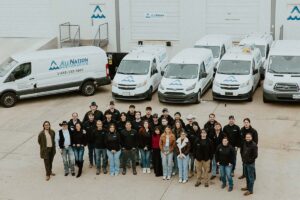 full team together with vans around